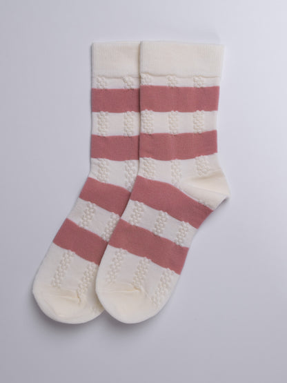 Pair of pink and white striped socks on a light gray background