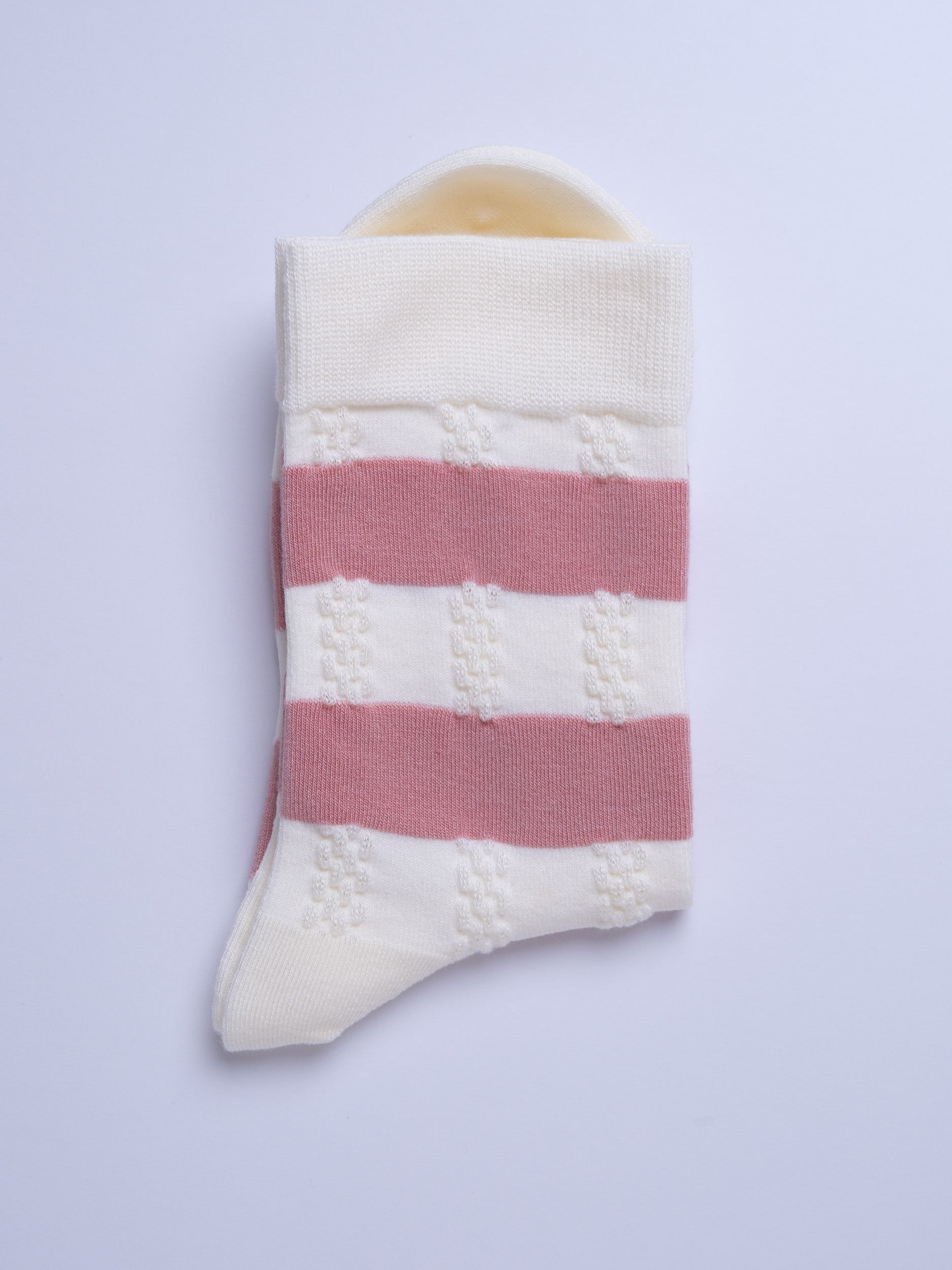 Striped sock with pink and white pattern on a light gray background