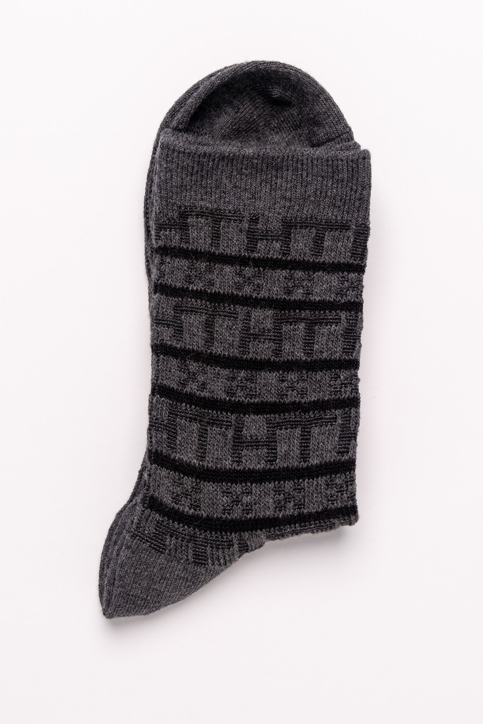 Gray sock with black pattern on a white background