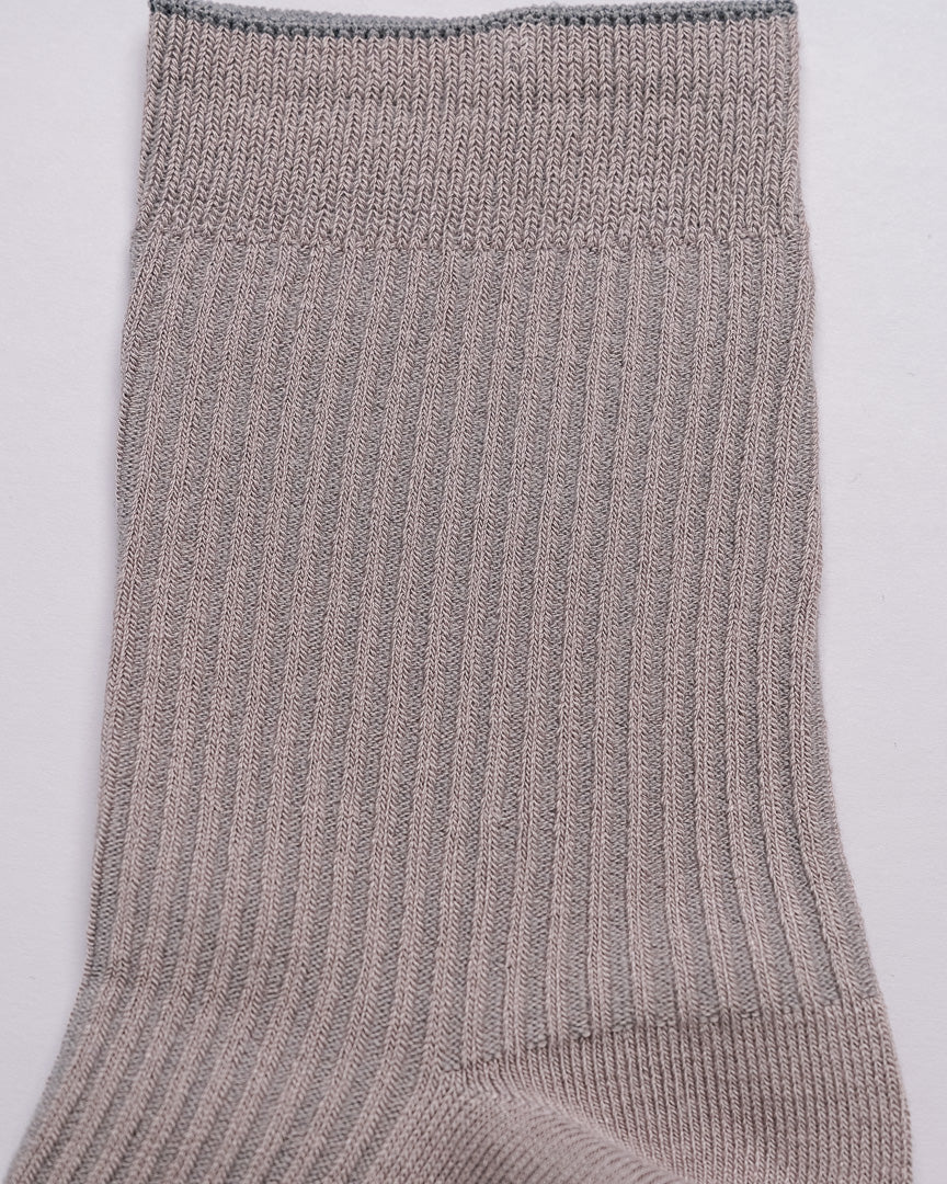 Close-up of a gray sock on a light gray background