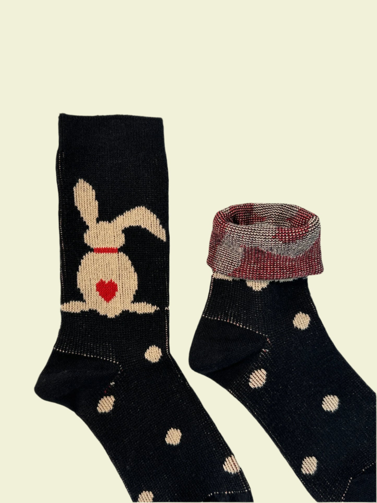 Black socks with a cartoon design on a light background