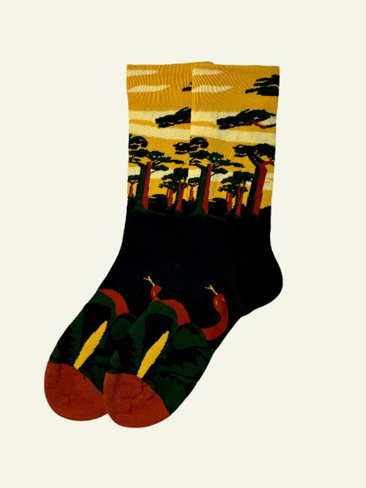 Cute and unique crew socks with sunset colors and nature-inspired elements, made from soft, stretchy cotton blend.